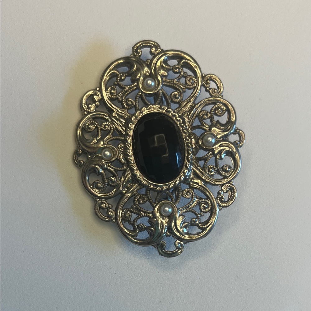 Ornate Silver and Black Brooch